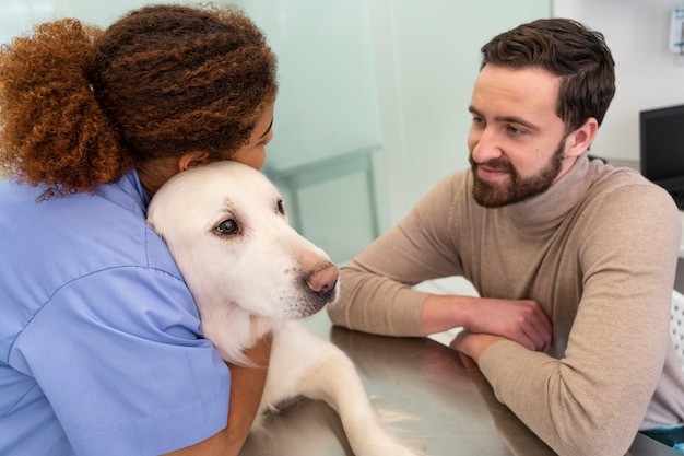 Medium shot doctor hugging dog