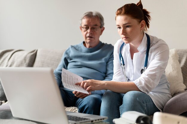 Medium shot doctor and man on couch