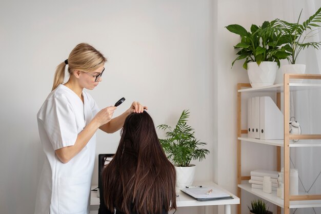 medium shot doctor treating dandruff