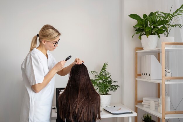 Medium shot doctor treating dandruff