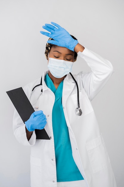 Medium shot doctor with protective equipment