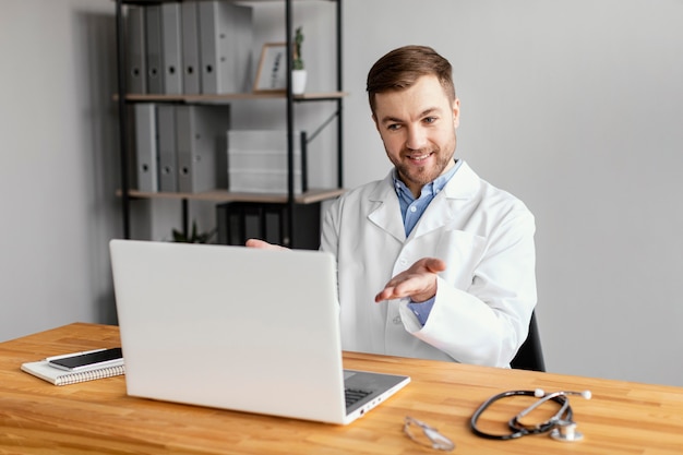 Medium shot doctor working at desk