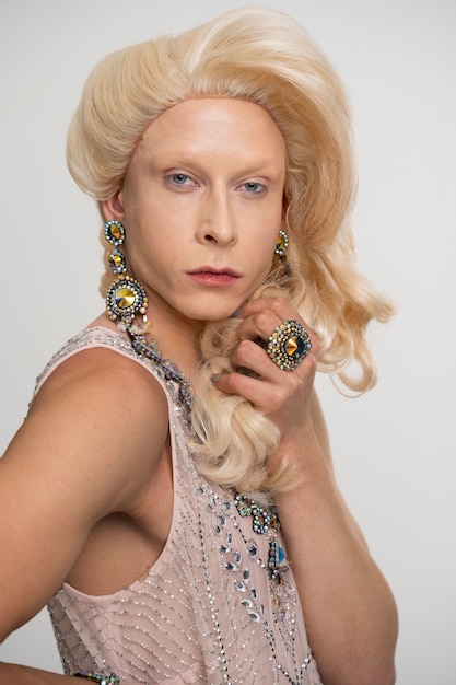 Medium shot drag posing with jewelry