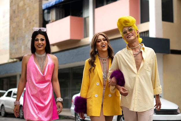 Medium shot drag queens walking together