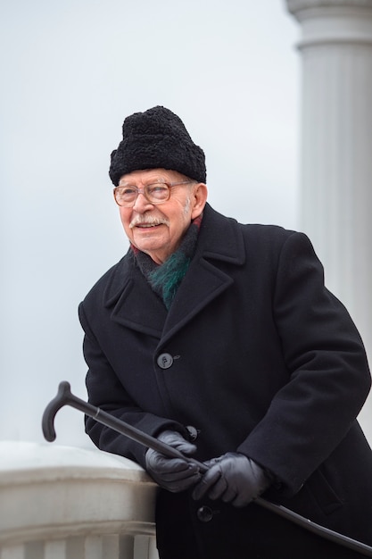 Free photo medium shot elderly man taking a stroll