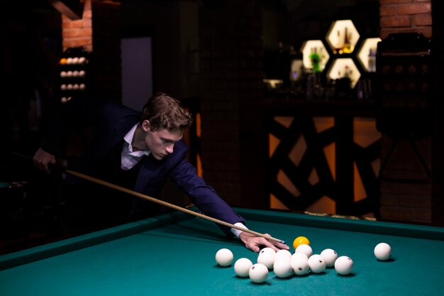 Medium shot elegant man with yellow balls