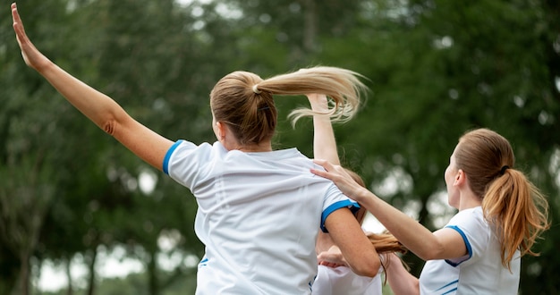 Medium shot excited women outdoors