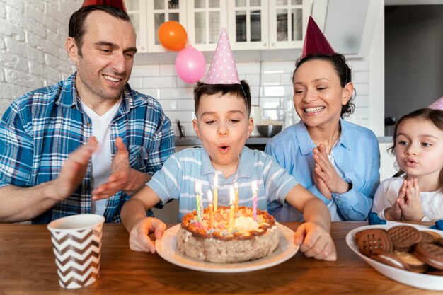 Medium shot family celebrating birthday