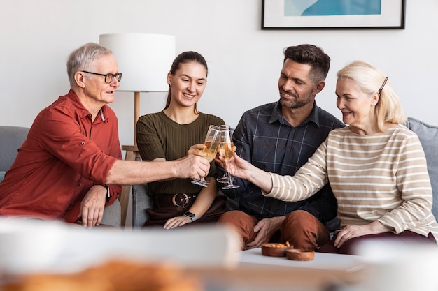 Medium shot family clinking glasses