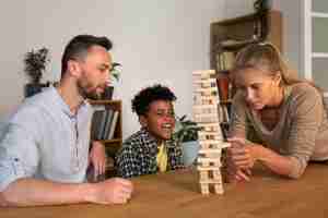 Free photo medium shot family members playing game