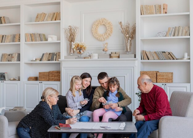 Medium shot family members sitting together