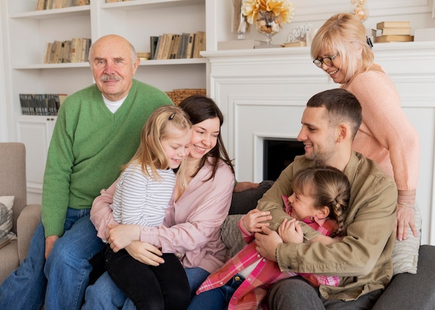 Medium shot family portrait indoors