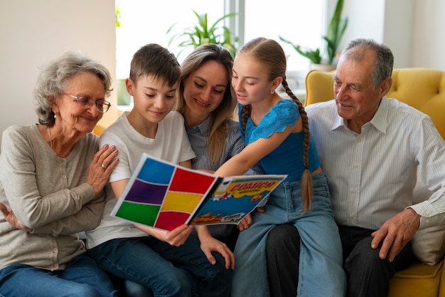 Medium shot family reading comics together