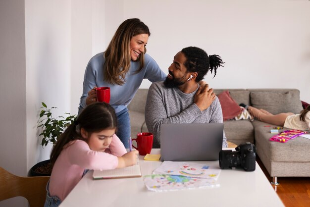 medium shot family sitting at table