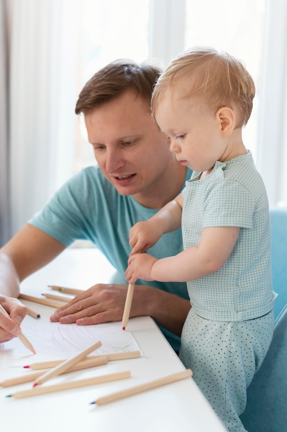 Medium shot father drawing with kid