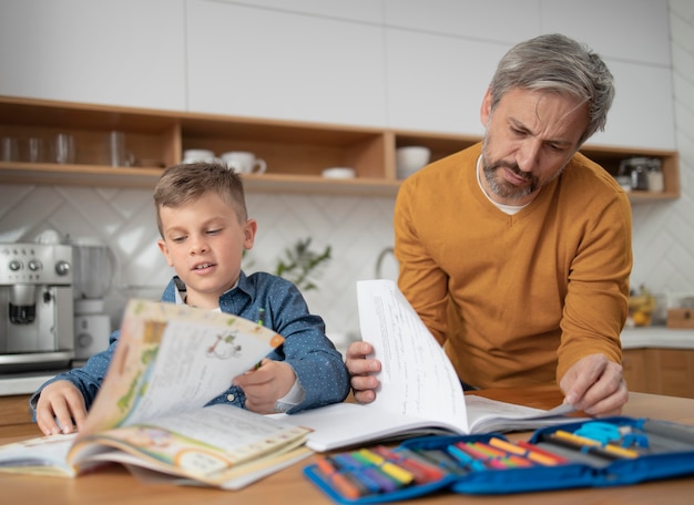 medium shot father helping kid