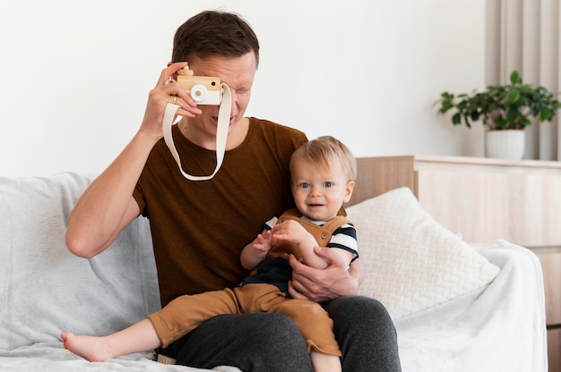 medium shot father holding kid