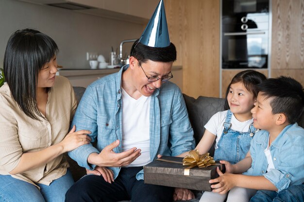 Medium shot father receiving gift