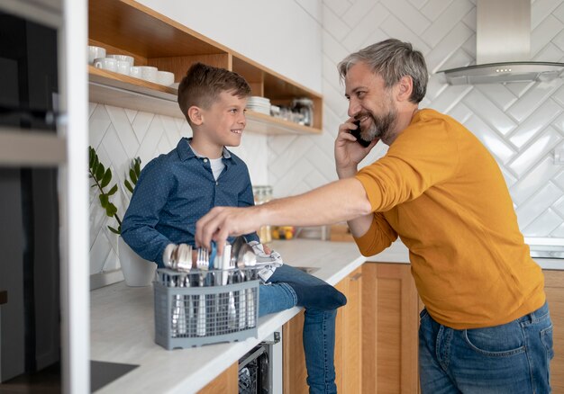 Medium shot father talking on phone