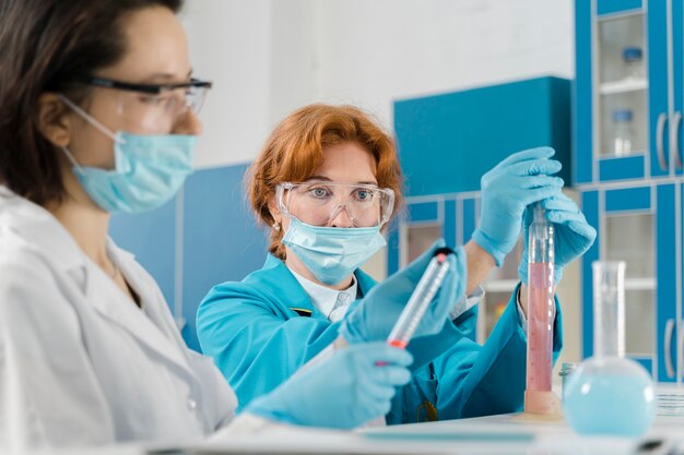 Medium shot of female doctors wearing masks