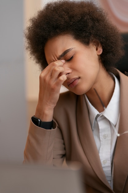 Medium shot female economist working in office