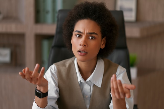 Medium shot female economist working in office