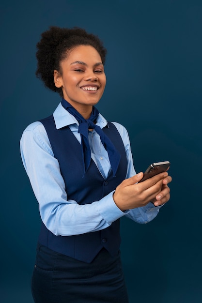 Free photo medium shot female flight attendant in studio