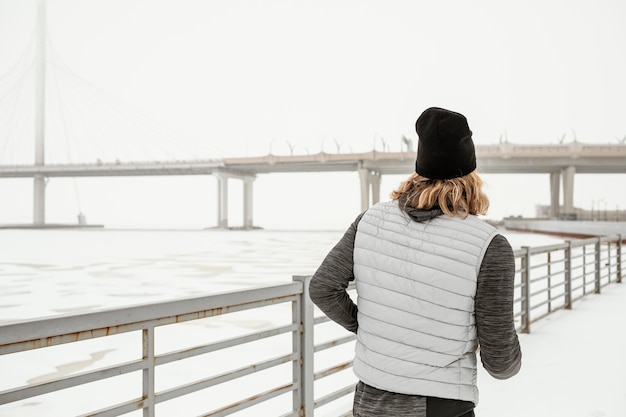 Medium shot fit man running outside