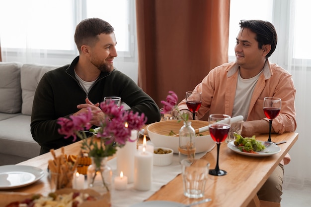 Medium shot friends at dinner party