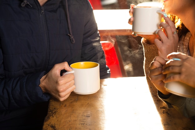 Medium shot of friends drinking coffee