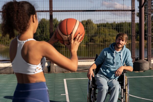 Medium shot friends playing basketball