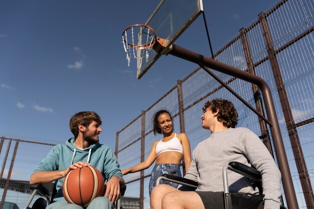 Medium shot friends playing basketball