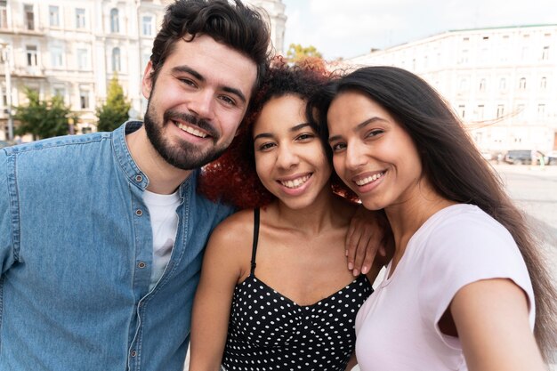 Medium shot friends posing together