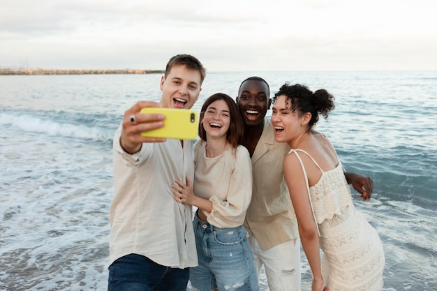 Medium shot friends taking selfie