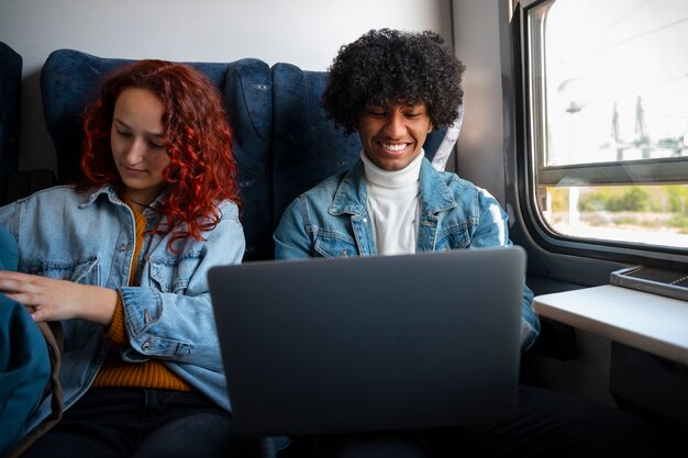 Medium shot friends traveling by train