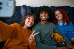 Free photo medium shot friends traveling by train