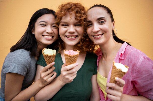 Medium shot friends with delicious ice cream