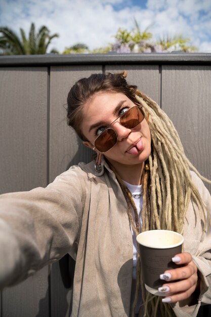 Medium shot funny woman with coffee cup