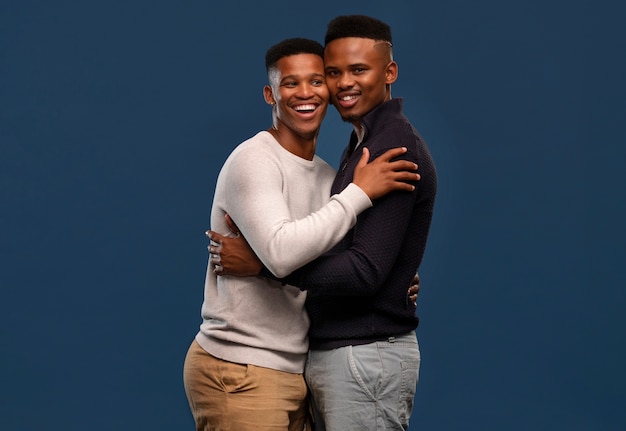 Free photo medium shot gay black men posing