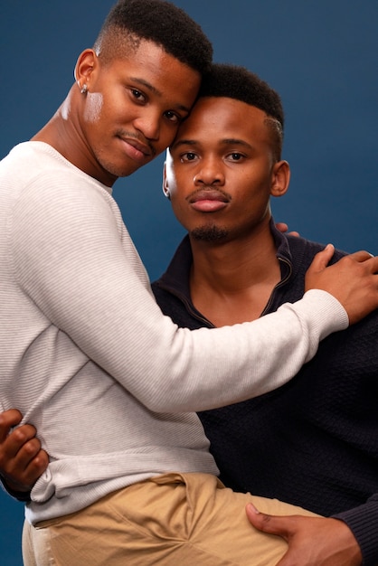 Free photo medium shot gay black men posing