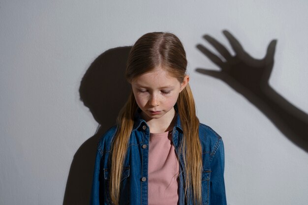 Medium shot girl being abused portrait