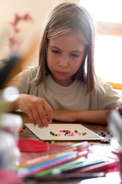 Medium shot girl being creative at home