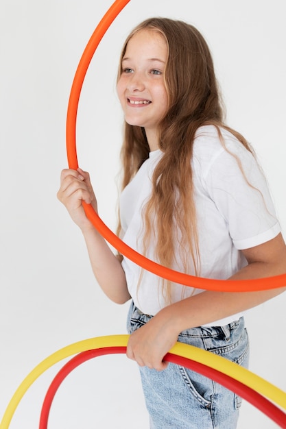 Medium shot girl holding circles