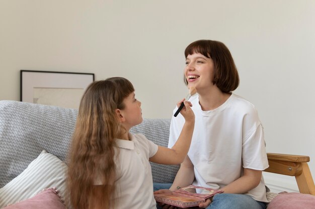 Medium shot girl holding make-up brush