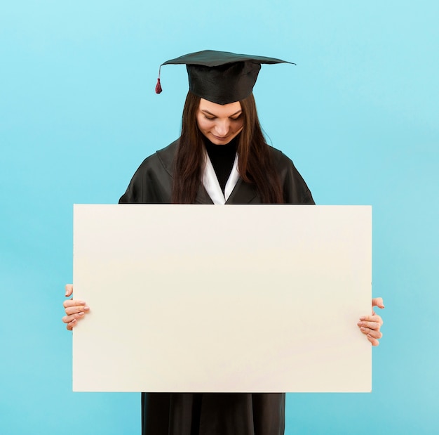 Medium shot girl holding placard