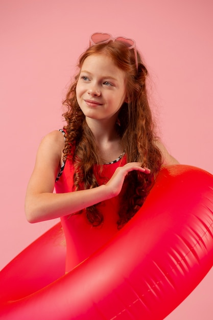 Free photo medium shot girl holding red lifeline