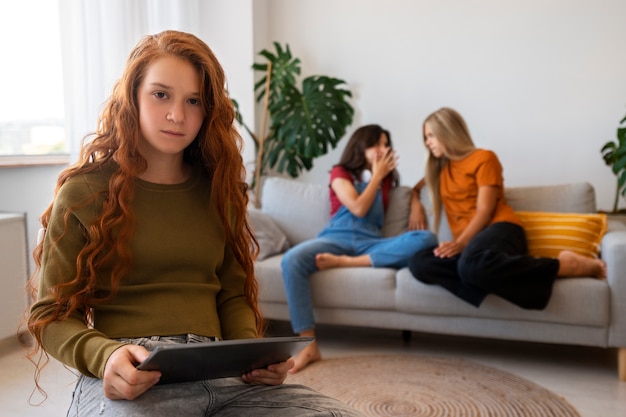 Medium shot girl holding tablet