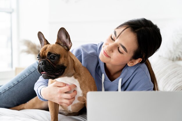 Medium shot girl looking at dog