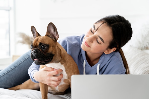 Medium shot girl looking at dog