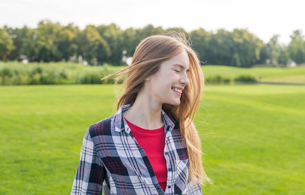 Medium shot girl looking happy outside